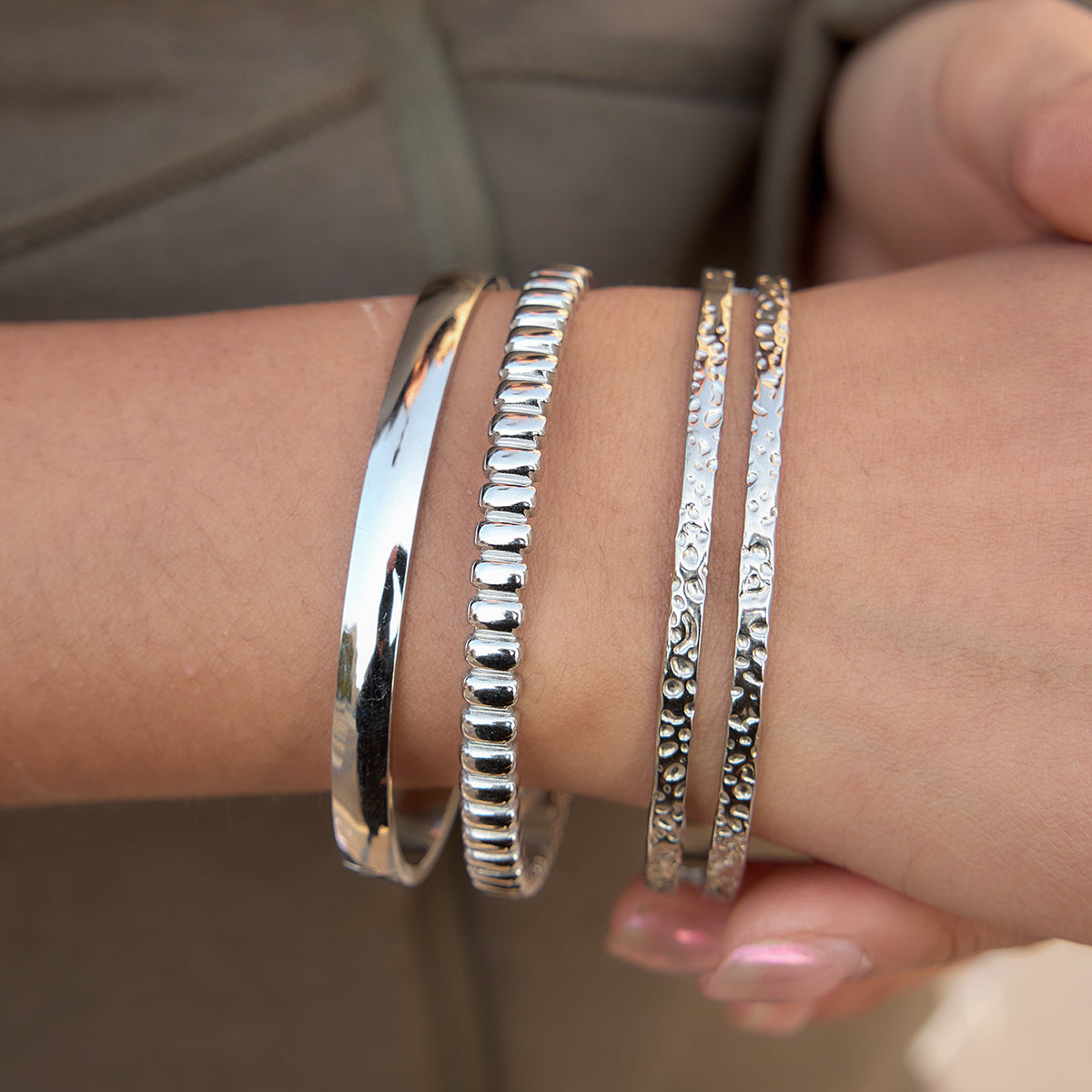 The Silver Sculpted Ribbon Bangle