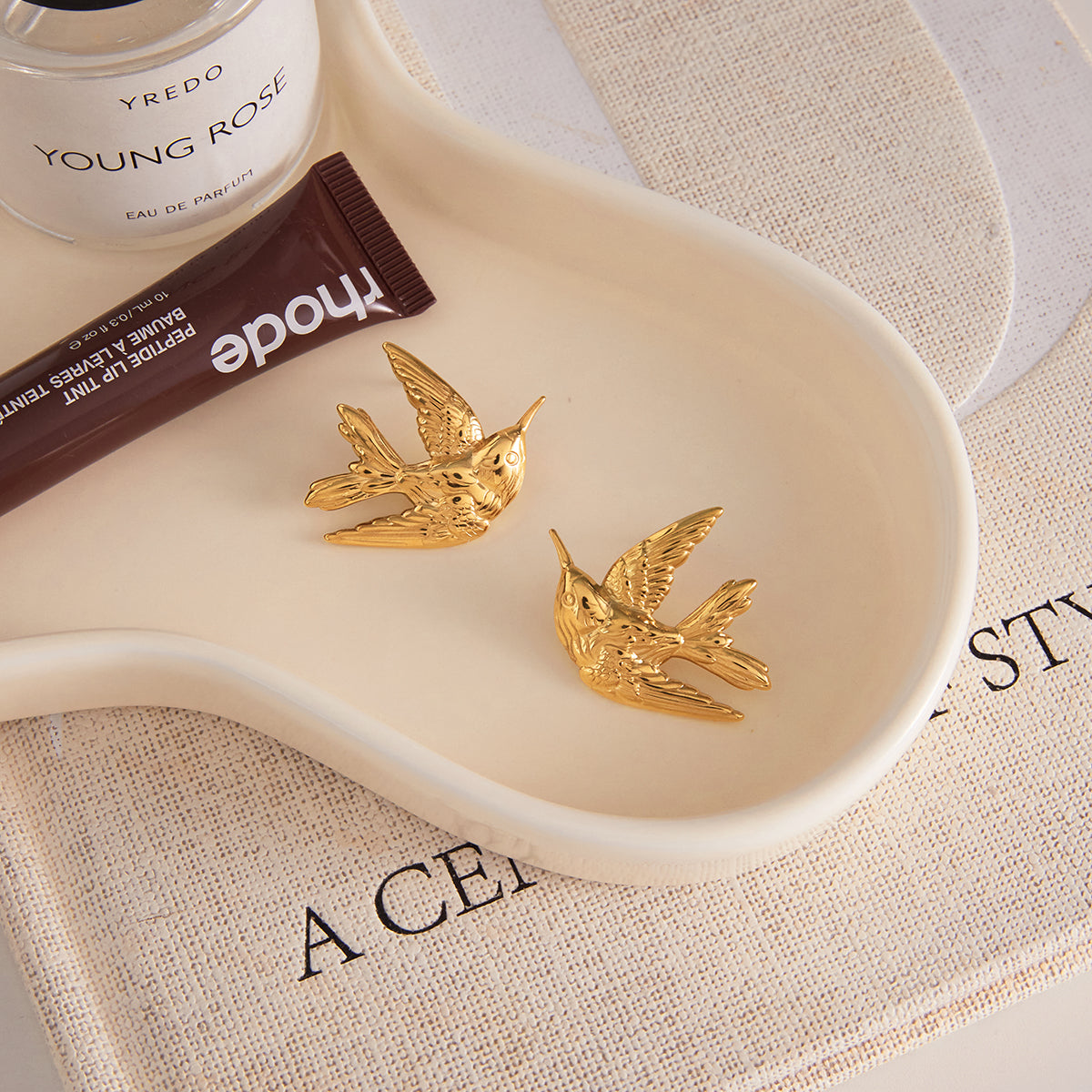 The Aria Golden Swallow Studs